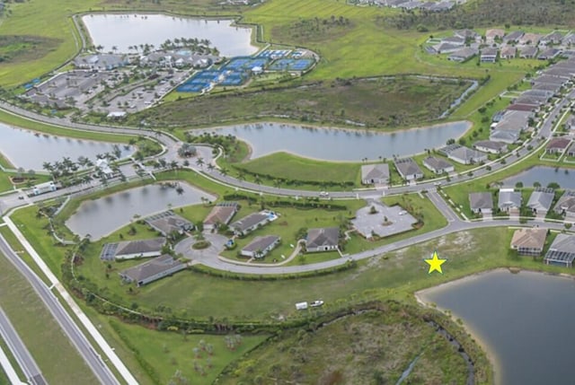 12755 SW Cattleya Ln Unit 224, Port Saint Lucie, FL 34987 - aerial overview of property's location featuring a large body of water and nearby suburban area