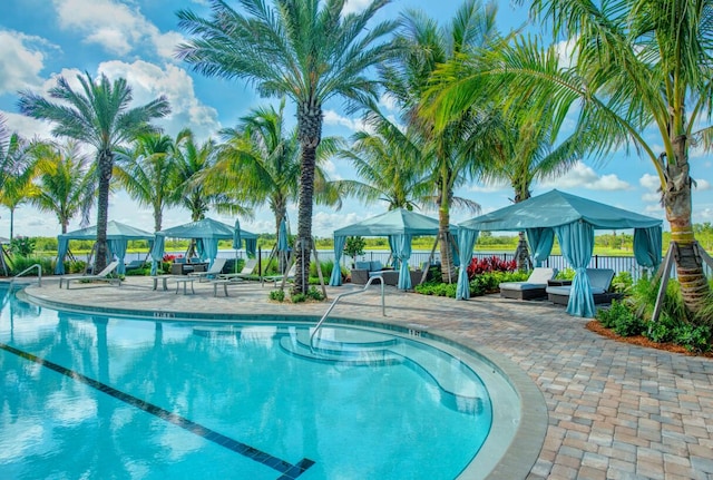 12755 SW Cattleya Ln Unit 224, Port Saint Lucie, FL 34987 - community pool featuring a gazebo and a patio area