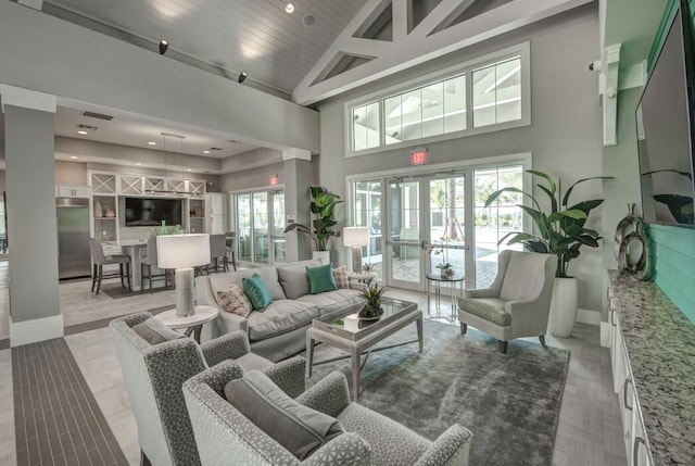 12755 SW Cattleya Ln Unit 224, Port Saint Lucie, FL 34987 - living room with a high ceiling and baseboards