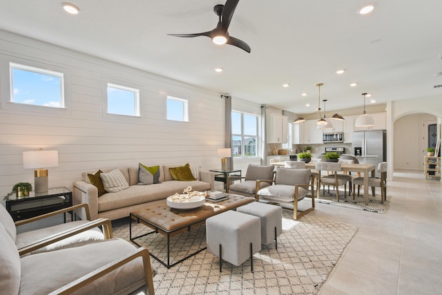 12755 SW Cattleya Ln Unit 224, Port Saint Lucie, FL 34987 - living area featuring arched walkways, healthy amount of natural light, ceiling fan, recessed lighting, and light tile patterned floors