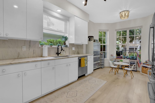 4220 NW 58th Ln, Boca Raton, FL 33496 - kitchen featuring backsplash, white cabinetry, light stone counters, light wood-type flooring, and recessed lighting