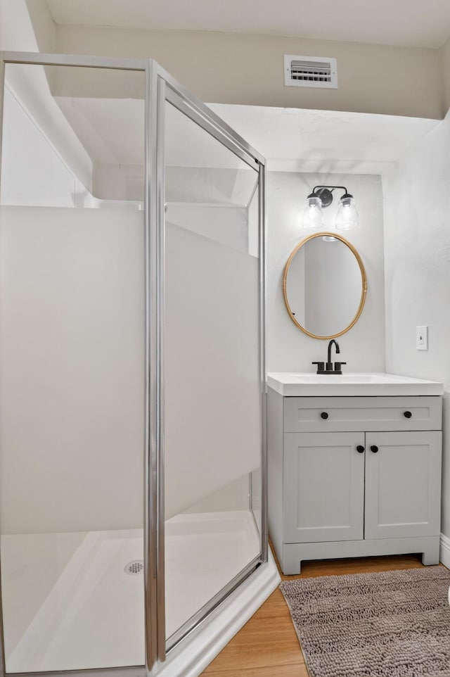 404 S M St Unit 1, Lake Worth Beach, FL 33460 - full bath featuring vanity, a stall shower, and wood finished floors