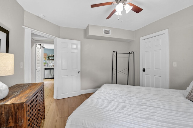 404 S M St Unit 1, Lake Worth Beach, FL 33460 - bedroom with wood finished floors, baseboards, and a ceiling fan