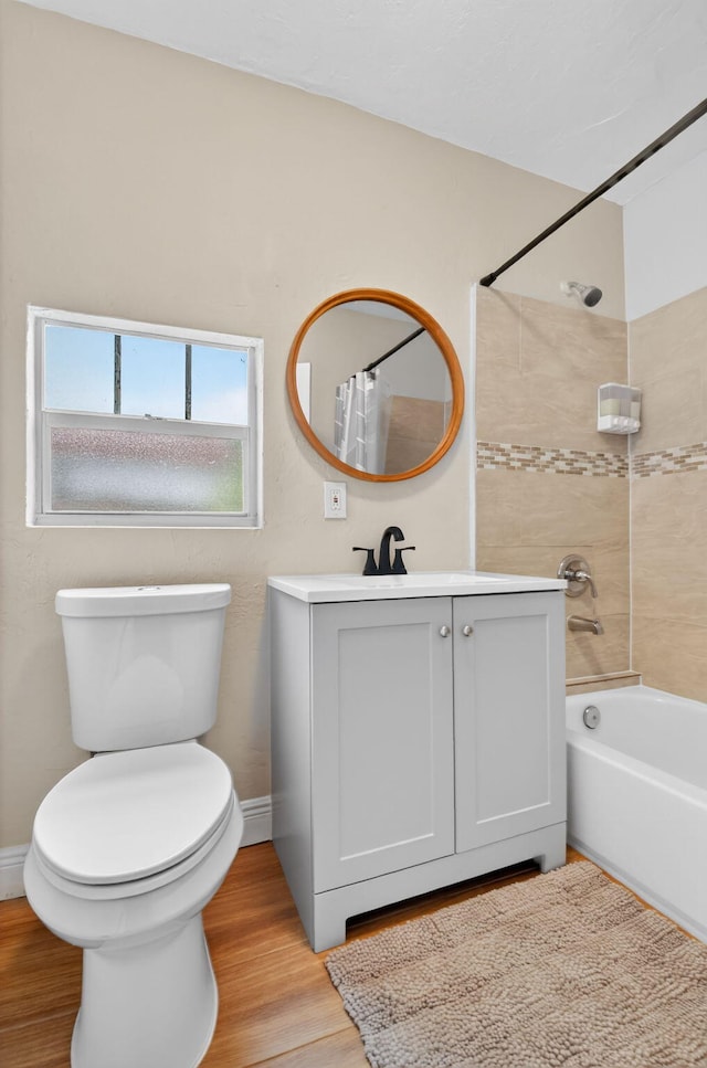 404 S M St Unit 1, Lake Worth Beach, FL 33460 - bathroom with vanity, toilet, wood finished floors, shower / bath combo, and baseboards