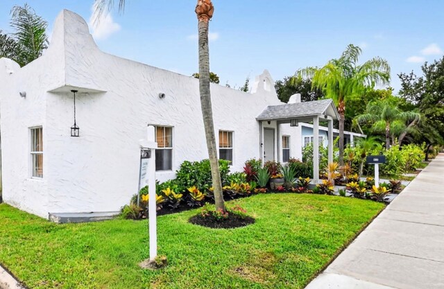 404 S M St Unit 1, Lake Worth Beach, FL 33460 - view of front of property with a front lawn and stucco siding