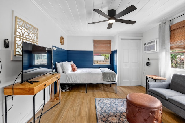 404 S M St Unit 1, Lake Worth Beach, FL 33460 - bedroom with an AC wall unit, wood finished floors, a closet, a ceiling fan, and wooden ceiling