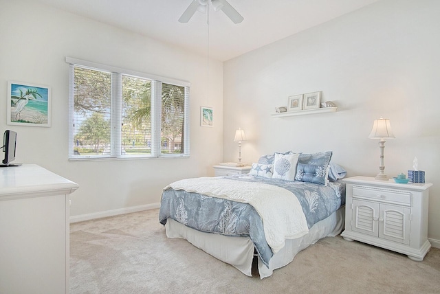 28 Harbour Isle Dr W Unit 101, Fort Pierce, FL 34949 - bedroom with light carpet, baseboards, and a ceiling fan