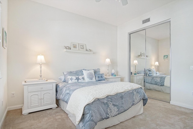 28 Harbour Isle Dr W Unit 101, Fort Pierce, FL 34949 - bedroom featuring light carpet, baseboards, and a closet