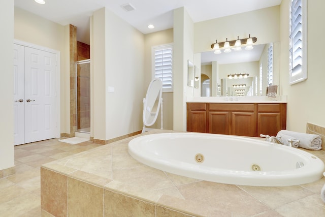 5621 SW Longspur Ln, Palm City, FL 34990 - bathroom featuring a shower stall, a whirlpool tub, vanity, and tile patterned flooring