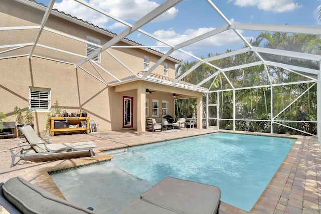 5621 SW Longspur Ln, Palm City, FL 34990 - outdoor pool featuring a patio area, a ceiling fan, and glass enclosure