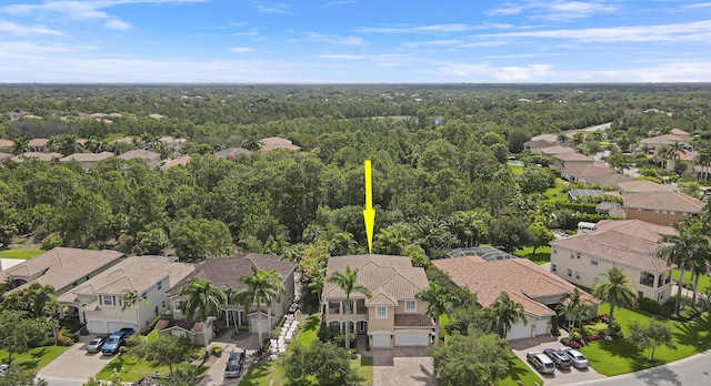 5621 SW Longspur Ln, Palm City, FL 34990 - aerial perspective of suburban area with a heavily wooded area