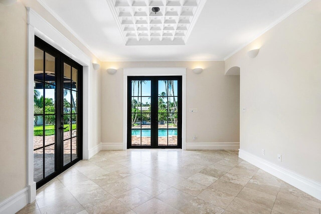 25 Harbor Dr, Lake Worth Beach, FL 33460 - empty room featuring french doors, crown molding, coffered ceiling, baseboards, and arched walkways