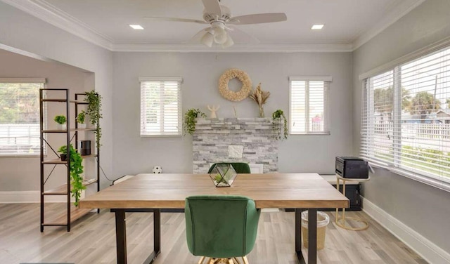 1022 State St, West Palm Beach, FL 33407 - dining area featuring healthy amount of natural light, wood finished floors, a ceiling fan, and crown molding