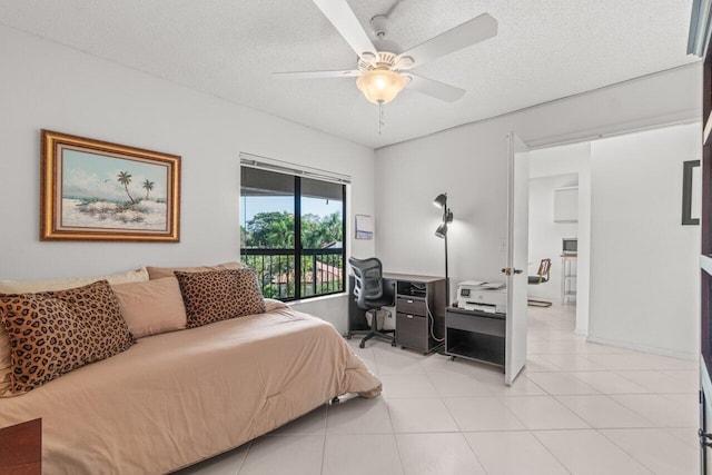 5380 Cedar Lake Dr Unit 303, Boynton Beach, FL 33437 - bedroom with an office area, a textured ceiling, light tile patterned flooring, access to outside, and ceiling fan