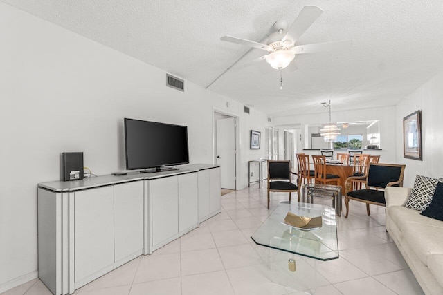 5380 Cedar Lake Dr Unit 303, Boynton Beach, FL 33437 - living room with a textured ceiling and ceiling fan