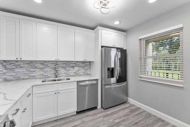 118 Lake Constance Dr Unit 118, West Palm Beach, FL 33411 - kitchen featuring stainless steel appliances, tasteful backsplash, white cabinetry, recessed lighting, and light stone countertops