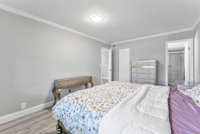 118 Lake Constance Dr Unit 118, West Palm Beach, FL 33411 - bedroom featuring ornamental molding, light wood-style flooring, and ensuite bathroom