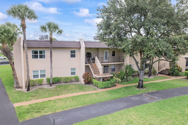 118 Lake Constance Dr Unit 118, West Palm Beach, FL 33411 - view of building exterior featuring stairway