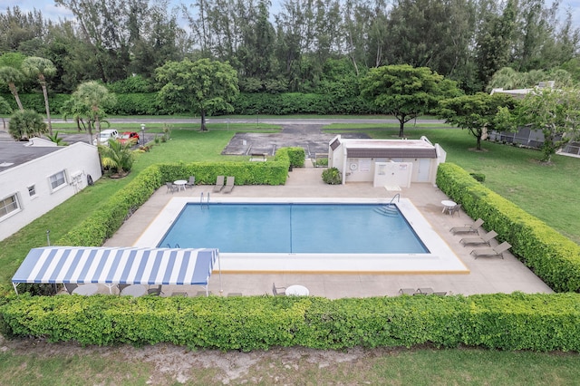 118 Lake Constance Dr Unit 118, West Palm Beach, FL 33411 - community pool with view of scattered trees, a patio area, and a yard