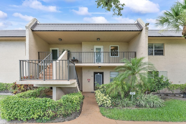 118 Lake Constance Dr Unit 118, West Palm Beach, FL 33411 - view of building exterior featuring stairway