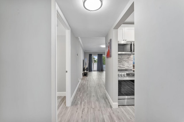 118 Lake Constance Dr Unit 118, West Palm Beach, FL 33411 - hallway featuring light wood-style floors and baseboards