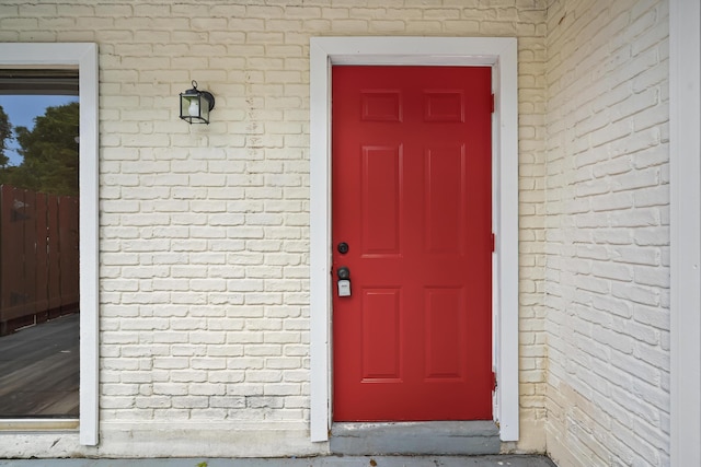 3571 SE Cobia Way, Stuart, FL 34997 - property entrance featuring brick siding