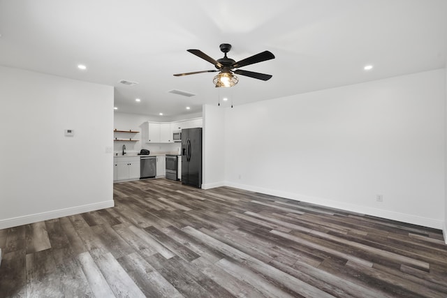 3571 SE Cobia Way, Stuart, FL 34997 - unfurnished living room with dark wood finished floors, a sink, a ceiling fan, recessed lighting, and baseboards