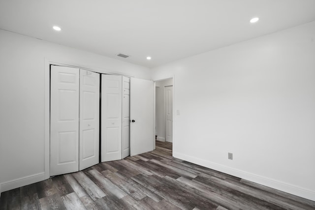 3571 SE Cobia Way, Stuart, FL 34997 - unfurnished bedroom with wood finished floors, recessed lighting, a closet, and baseboards
