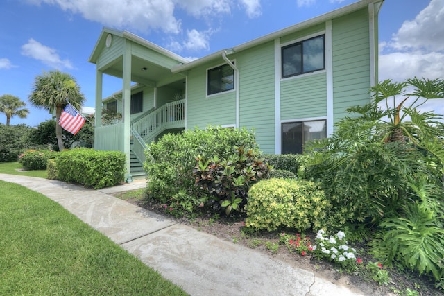 5725 Pelican Pointe Dr Unit 4, Sebastian, FL 32958 - view of building exterior with stairs