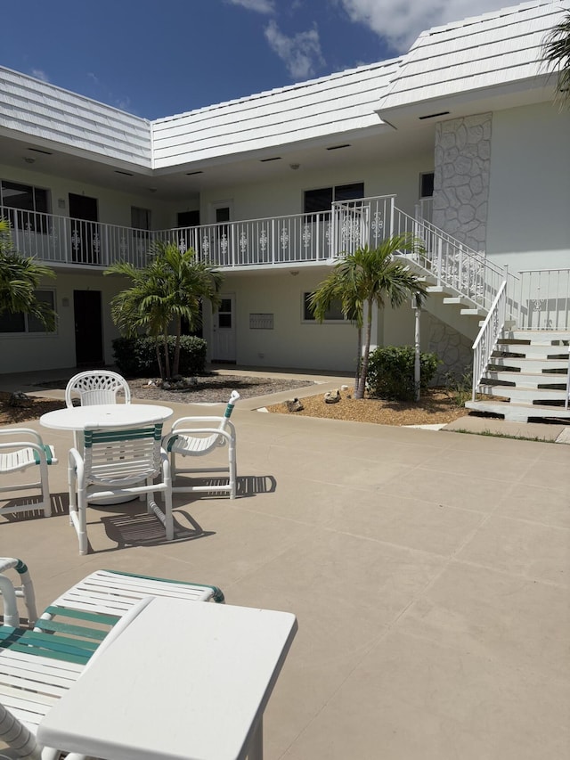 118 Yacht Club Dr Unit 1, North Palm Beach, FL 33408 - view of patio / terrace with stairway