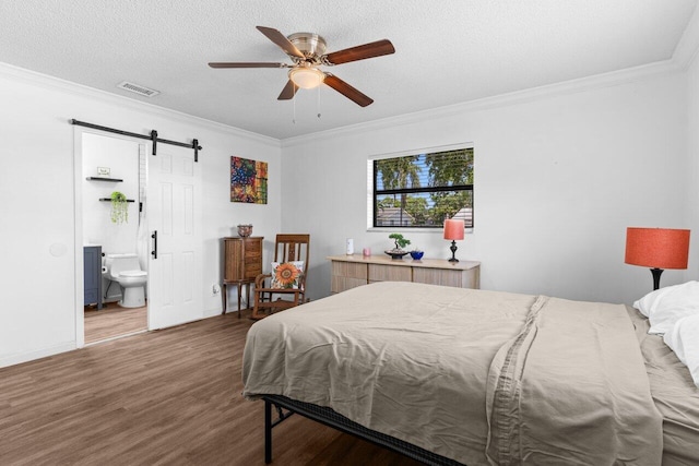 4694 Brady Blvd, Delray Beach, FL 33445 - bedroom with a barn door, wood finished floors, crown molding, ensuite bath, and a ceiling fan