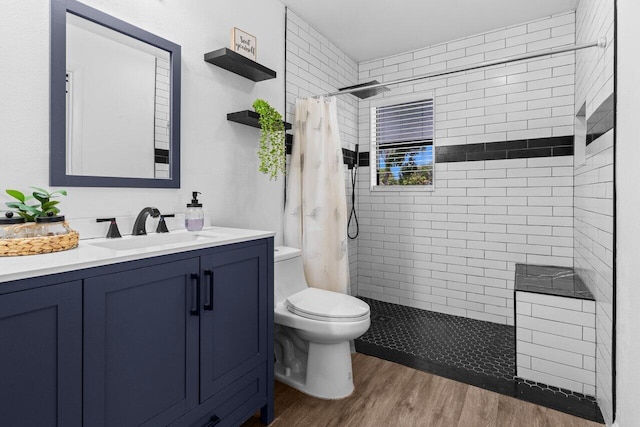 4694 Brady Blvd, Delray Beach, FL 33445 - bathroom featuring tiled shower, wood finished floors, and vanity