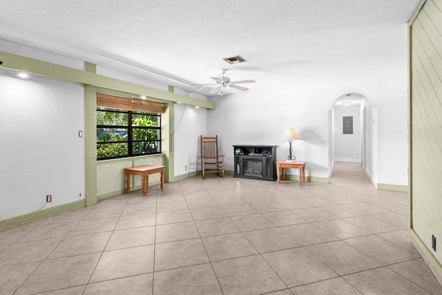 4694 Brady Blvd, Delray Beach, FL 33445 - unfurnished living room featuring arched walkways, a textured ceiling, tile patterned flooring, and ceiling fan