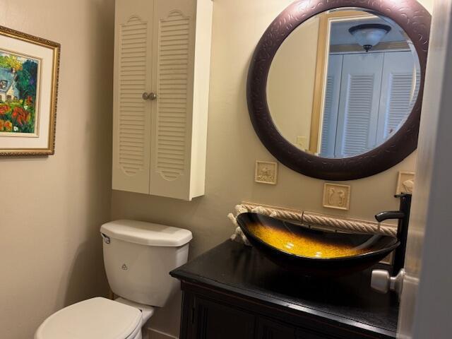 368 Sheffield O, West Palm Beach, FL 33417 - half bathroom with vanity and a closet