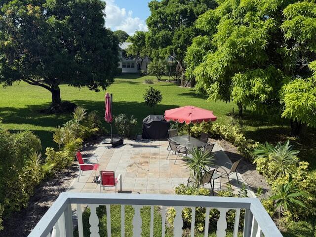 368 Sheffield O, West Palm Beach, FL 33417 - view of grassy yard with a patio