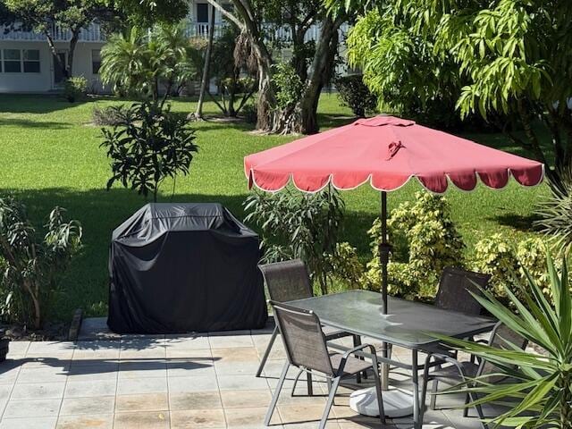 368 Sheffield O, West Palm Beach, FL 33417 - view of patio / terrace with a grill and outdoor dining area