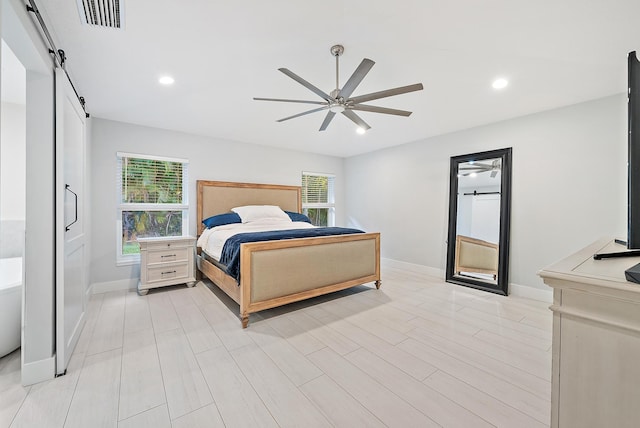 19960 Earlwood Dr, Jupiter, FL 33458 - bedroom featuring a barn door, a ceiling fan, and recessed lighting