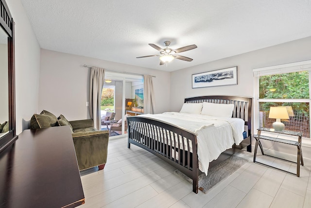 19960 Earlwood Dr, Jupiter, FL 33458 - bedroom with multiple windows, access to outside, ceiling fan, and a textured ceiling