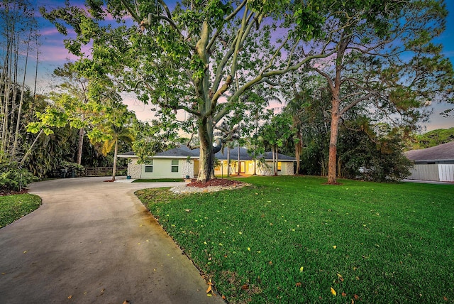 19960 Earlwood Dr, Jupiter, FL 33458 - view of front of property with a lawn and concrete driveway
