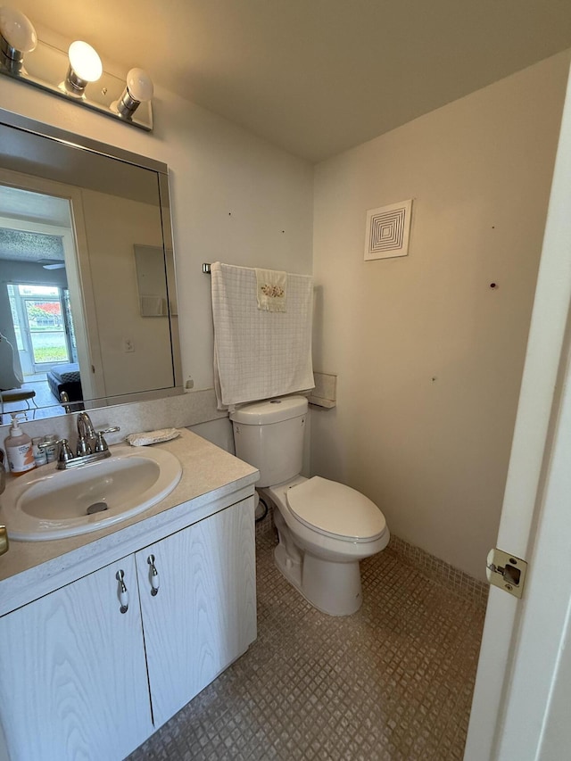 1041 Guildford C, Boca Raton, FL 33434 - half bath featuring toilet and vanity