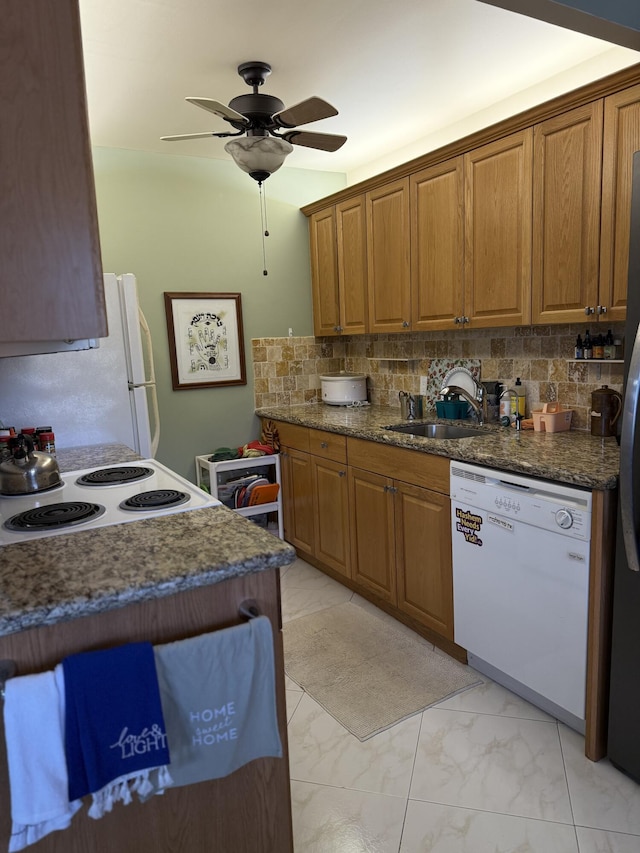 1041 Guildford C, Boca Raton, FL 33434 - kitchen featuring white appliances, brown cabinetry, light marble finish floors, backsplash, and ceiling fan