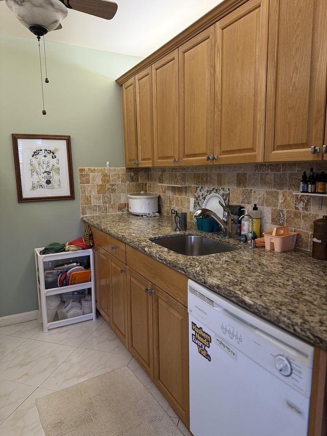 1041 Guildford C, Boca Raton, FL 33434 - kitchen featuring dishwasher, a sink, decorative backsplash, and brown cabinets
