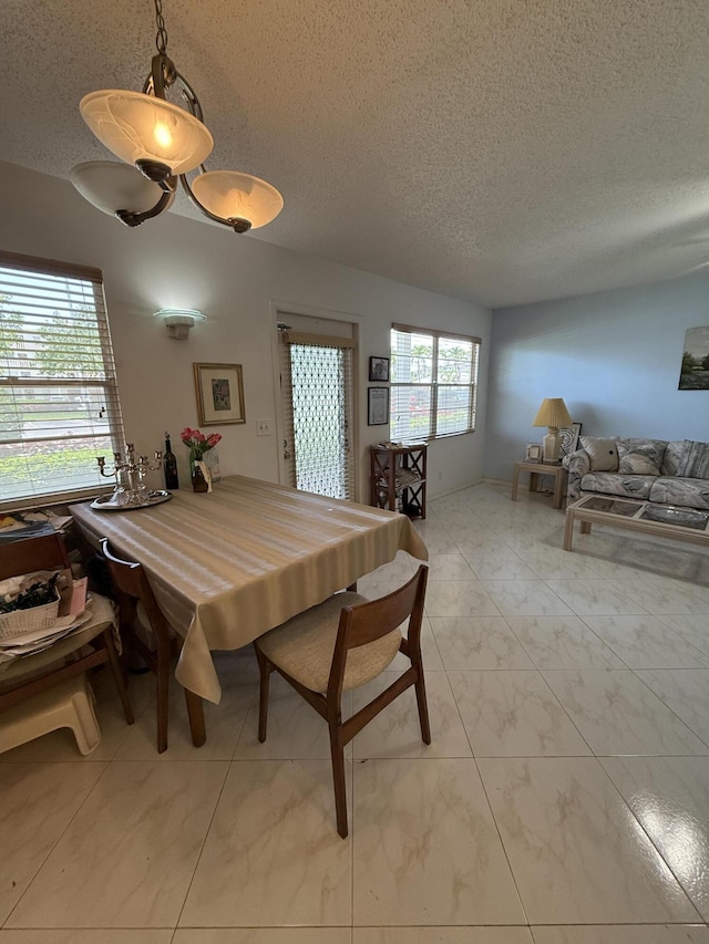 1041 Guildford C, Boca Raton, FL 33434 - dining space featuring a textured ceiling