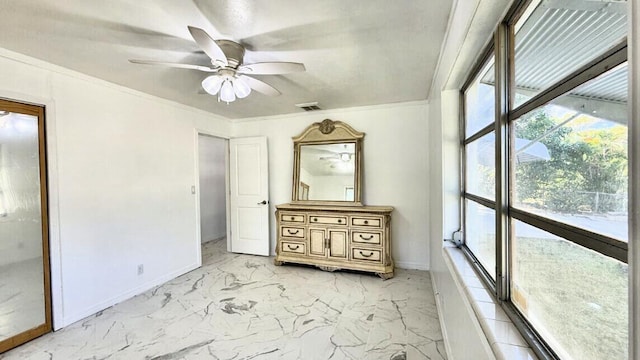802 Lytle St, West Palm Beach, FL 33405 - unfurnished bedroom with baseboards, light marble finish floors, crown molding, and ceiling fan