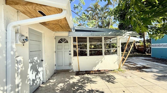 802 Lytle St, West Palm Beach, FL 33405 - view of exterior entry featuring a patio area