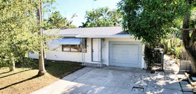802 Lytle St, West Palm Beach, FL 33405 - single story home with a garage, stucco siding, concrete driveway, and a shingled roof