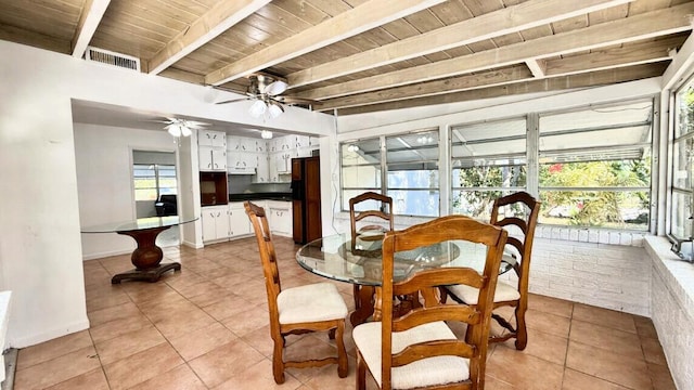 802 Lytle St, West Palm Beach, FL 33405 - dining room with light tile patterned flooring, ceiling fan, wood ceiling with exposed beams, and baseboards