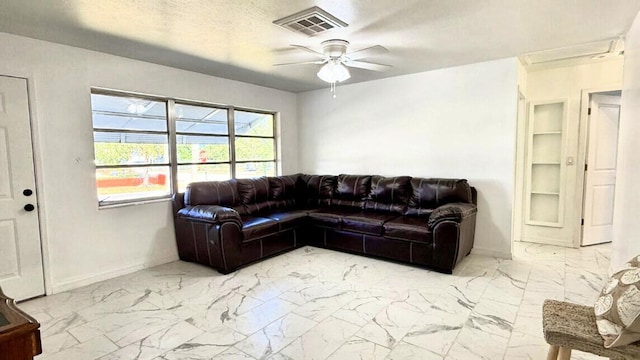 802 Lytle St, West Palm Beach, FL 33405 - living area featuring light marble finish floors, baseboards, and a ceiling fan