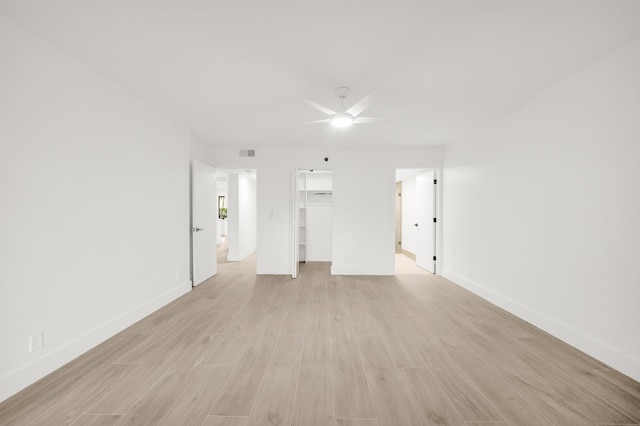 7290 Kinghurst Dr Unit 102, Delray Beach, FL 33446 - unfurnished living room with a ceiling fan, light wood-style floors, and baseboards