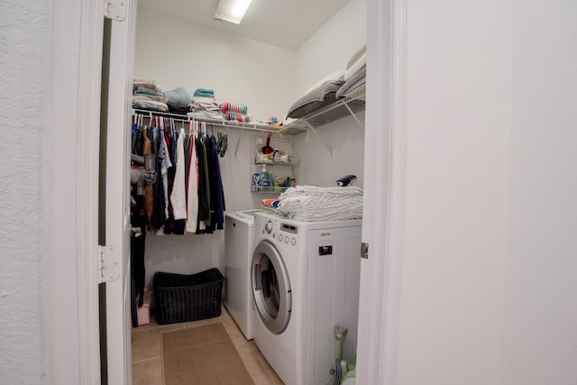 1020 E Longport Cir Unit A1, Delray Beach, FL 33444 - laundry room featuring separate washer and dryer and light tile patterned flooring